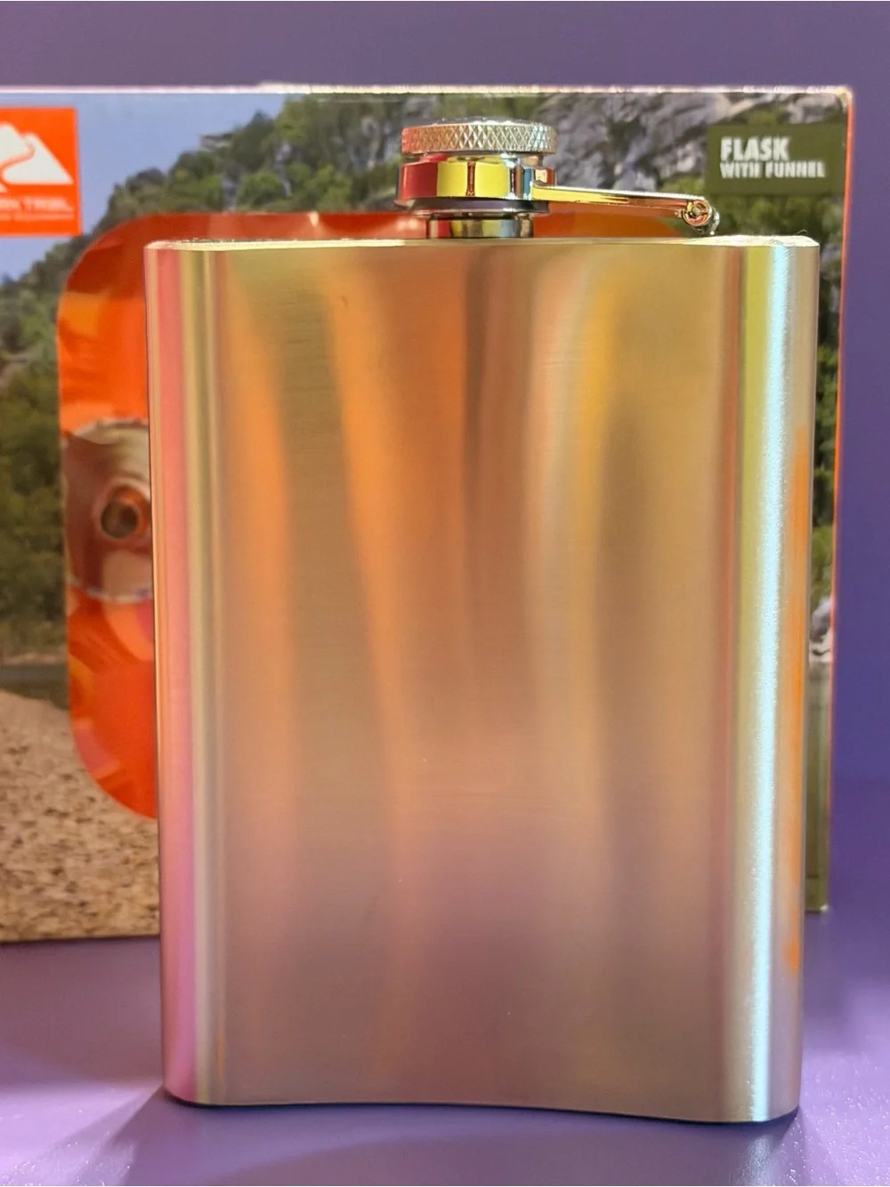 Ozark Trail Silver Hip Flask with Blue Forest and Orange Sun Design